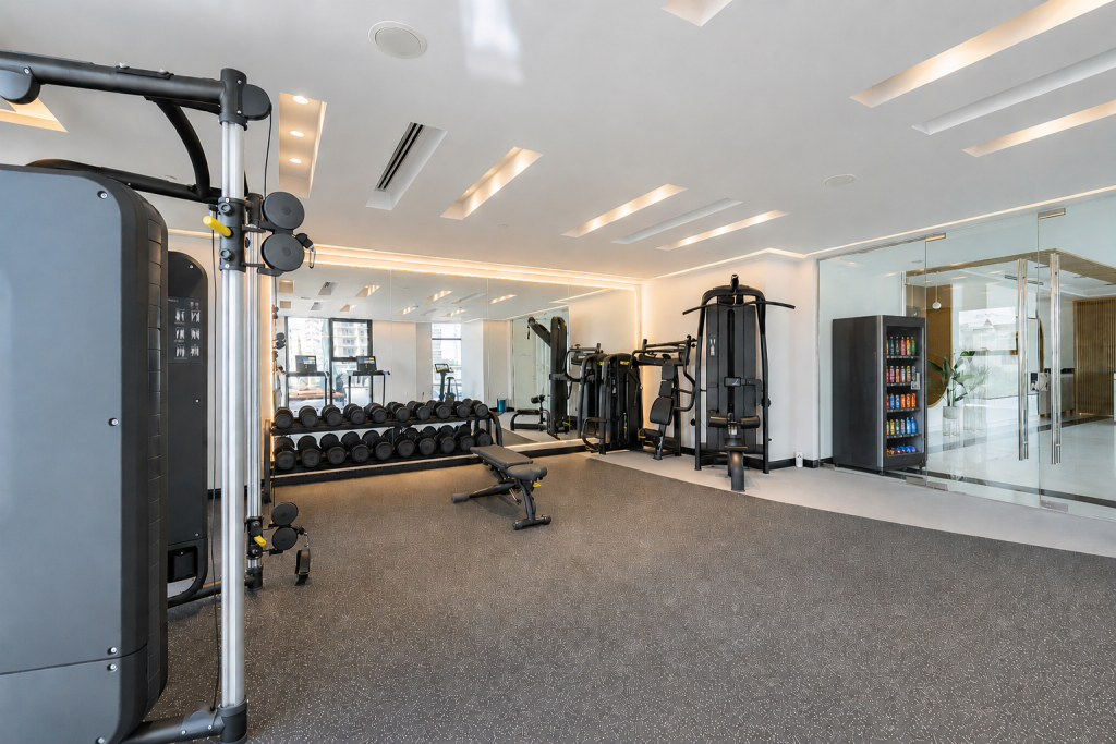 Single smart fridge vending machine placed in a commercial gym environment.